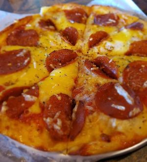 **Our Famous 3 Cheese Pepperoni Pizza** Your choice of 10" House Made crust made with Non-GMO NEVER BLEACHED NEVER BROMATED flour, House marinara, topped with Three Layers of House at Pythagoras Conscious Food Philosophy in Houston