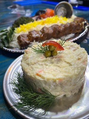 Potato Salad
Persian style potato salad (Salad Olvieh) made with potato, sweet peas, pickles, grilled chicken, carrots, vegan mayo, and just egg at Pythagoras Conscious Food Philosophy in Houston