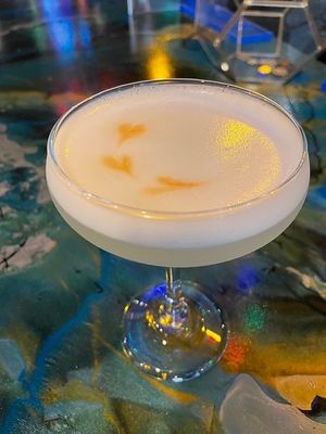 Classic Whiskey Sour with Vegan egg foam. at Pythagoras Conscious Food Philosophy in Houston