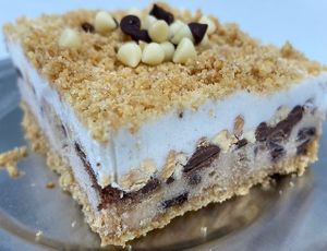 Ice Cream Cake
Peanut butter chocolate cashew ice cream and vanilla bean coconut ice cream, layered with Reese’s peanut butter hard shell syrup and chopped nuts, all on top of b at Pythagoras Conscious Food Philosophy in Houston