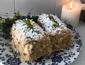 Napoleon
Classic French Flaky Puff Pastry layered with fresh coffee or banana or vanilla whipped cream, topped with powdered sugar and pistachio.

  at Pythagoras Conscious Food Philosophy in Houston