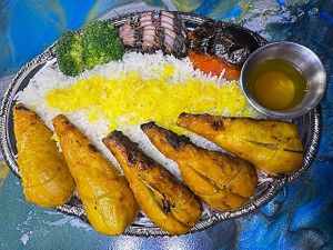 Chicken Kabob
﻿Bamboo Bone-In Gluten Free Chicken Skewer kabob made with Non-GMO soy protein marinated in Golden Persian saffron grilled to perfection over Persian style basmati at Pythagoras Conscious Food Philosophy in Houston