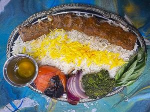 Kabob Koobideh
Persian style ground beef kabob skewer made with Non-GMO Pea protein, veggies and herbs, over Persian style basmati rice with side of butter and grilled tomato, gri at Pythagoras Conscious Food Philosophy in Houston