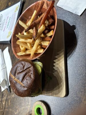 The pretzel buns here are unreal and the Kabob Koobideh patty is delicious. I’ll be dreaming about this burger. And the sweet potato fries are perfect!  at Pythagoras Conscious Food Philosophy in Houston