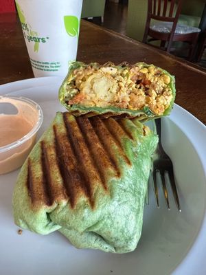 Vegan Treehugger Wrap- Tofu scramble, tots, spinach, sautéed peppers and onions, vegan breakfast sausage, vegan cheese, and tomatoes at Drunken Monkey Coffee Bar in Orlando