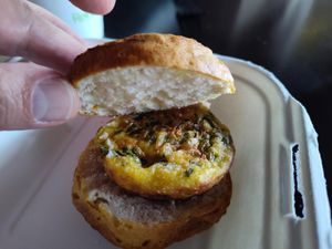 Just Egg patty made of Just Egg, vegan cheese, spinach, sauteed and onions on a biscuit at Drunken Monkey Coffee Bar in Orlando
