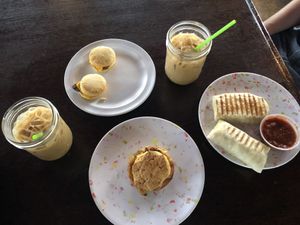 Top left: Vegan Pleasin’ mini biscuit with sausage and cheese. Middle: Just egg biscuit. Right: Vegan breakfast burrito at Drunken Monkey Coffee Bar in Orlando