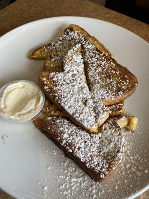 Vegan French Toast.   Three Slices of Texas Bread dipped in Our Own Dairy Free Batter, cooked to Perfection, sprinkled with Cinnamon and Powdered Sugar  at Colony Diner in Wallingford
