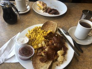 Tofu scramble (comes with toast and home fries) + added Upton bacon for $5. Partner’s sandwich in background came without any sides but she shared mine. :) at Colony Diner in Wallingford