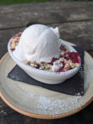 Apple and blueberry crumble with coconut ice-cream at The Old Lodge in Stroud