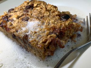 Healthy Baked Oatmeal: Oats, Dried Cherries & Raisins baked w/ Vanilla Soy Milk and a dash of Cinnamon, served w/ choice of steamed Oat, Soy or Almond Milk at Anna's House in Kalamazoo