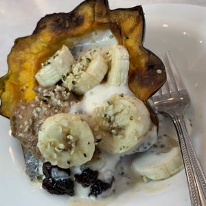 Everything Autumn Acorn Squash Bowl: Pumpkin Spice Chia Seed Pudding, Almond Yogurt & Peanut Butter Mousse, Bananas, Hemp Seed Hearts, Candied Pecans, Dried Cherries, Maple Syrup at Anna's House in Kalamazoo