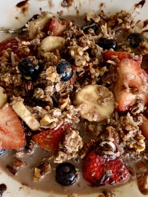 WARM CHOCOLATEY QUINOA, FRESH BLUEBERRIES, STRAWBERRIES, BANANAS, TOASTED COCONUT, WALNUTS, PECANS, DRIZZLED W/DARK CHOCOLATE SAUCE & Steamed almond milkk  at Anna's House in Kalamazoo