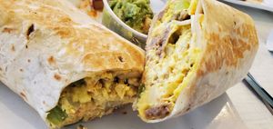 Vegan breakfast burrito w/Vegan eggs, sausage  & cheese + onion & green pepper. 😋 at Anna's House in Kalamazoo