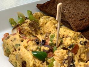 Vegan Scramble: Vegan Eggs, Vegan Sausage, Vegan Cheeze, Tomatoes, Green Peppers, Onions, Mushrooms, served w/ choice of Toast at Anna's House in Kalamazoo