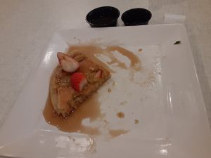 Partially consumed vegan pancake with fruit. at Anna's House in Kalamazoo