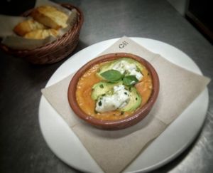 Organic avocado with tomato sauce, pesto and vegan mozzarella baked at Spiral in Nerja