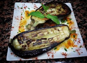 Berenjena asada servida con cous cous y arroz integral con salsa de yogurt y menta at Spiral in Nerja