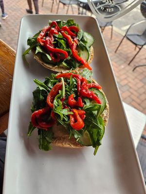 Bagel with hummus, cucumbers, spring mix, and roasted red peppers. at Steel City Coffeehouse and Brewery in Phoenixville