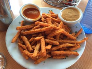 Sweet potato fries with Buffalo (left) and Chipotle (right) sauce at Saturn Cafe in Santa Cruz