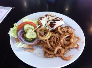 vegan BBQ ranch chicken burger with onion strings at Saturn Cafe in Santa Cruz