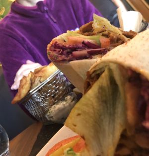 Seitan wrap with chips & tofish in the background  at Wine & Reason in Worthing