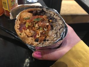 Burrito in wholemeal tortilla, sobroso (marinated soya chunks), brown rice, pico de gallo, black beans, hot salsa. Just half of it is displayed on the photo at Tolteca in Dublin