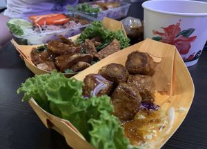 Deep fried skin tofu rolls, garlic tempeh, barbecued red porkless with rice, grilled chicken dip, complimentary soup at So Vegan - Gateway Ekkamai in Bangkok