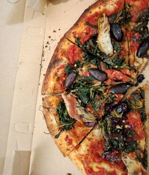 "Popeye" Vegan Pizza with artichokes, olives, spinach, herbs and spices at Minghettis - Food Truck in Blenheim