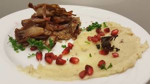 Raw walnut and caramelized shallots tart with parsnip purée.  at Le Poisson Sans Bicyclette in Brussels