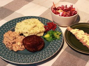 Swedish Patty (Pannbiff) with Creamed Mushroom sauce, Mash potatoe, Pressgurka (pickled Cucumbers) Lingonberries, Raw Slaw and Swedish Crisp bread at Dauns in East London