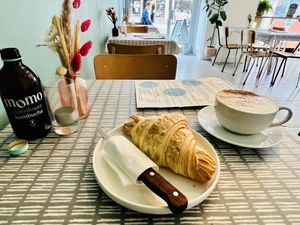 Croissant, turmeric latte and elderflower kombucha   at Dauns in East London