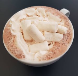 Vegan hot chocolate with whipped cream and marshmallows at Delivore in Stockholm