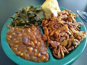 Soy curls, baked beans, collard greens and a roll. at Black Bear BBQ in Asheville