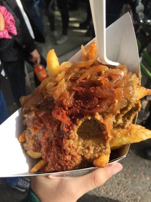 Fries with caramelized onions, olive tapenade and merkén.  at Papachecos in Santiago