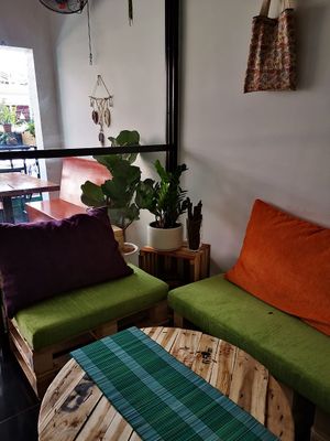 Cozy and colorful living room space upstairs  at Bun Bar in Ho Chi Minh City