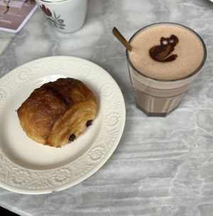 Pain au chocolate and a hot chocolate  at L'Alchimiste in Brussels
