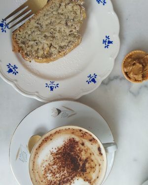 Oat milk cappuccino and banana bread with peanut butter at L'Alchimiste in Brussels