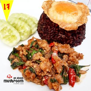 Omni mince stir fried with basil leaves top with vegan fried egg at All About Mushroom in Bangkok