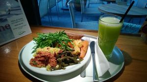 full sampling of buffet food for late lunch and a green juice to enjoy with it at Tibits in London