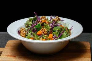 Seasonal Salad - lettuce, mixed salad, purple cabbage, pumpkin cubes with pepper, walnuts and pumpkin seeds  at WellDone Burger - Caprarie in Bologna