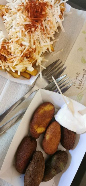 Croquetas de espinacas, calabaza y remolacha. Papas locas (con queso y chorizo vegan) at Mel Vegan Fast Food in Tenerife