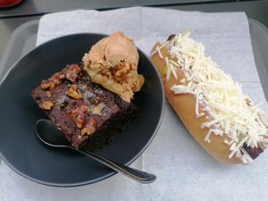 Spinach hot dog and chocolate brownie with icecream at Mel Vegan Fast Food in Tenerife
