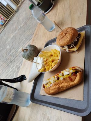 Hot dog and burger menu with fries and water at Mel Vegan Fast Food in Tenerife