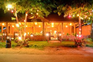 The restaurant is built like an authentic Tazaung (a Buddhist adoration hall or shrine pavilion) with fourteen massive teak pillars and large teak beams supporting the roof. at 7 Sisters Restaurant in Bagan