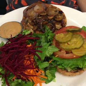 teriyaki burger (vegan patty with fried onions and mushrooms, teriyaki sauce & salad at Ananda Fuara in San Francisco