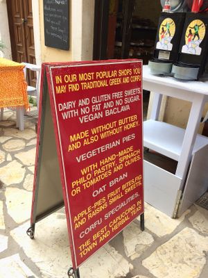 A-board outside her small bakery/cafe.  at Rose's Bakery in Corfu