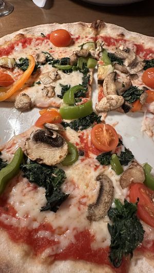 Pizza with vegan cheese, tomatoes, zucchini, mushrooms, spinach, sweet peppers   at Piola in Miami Beach