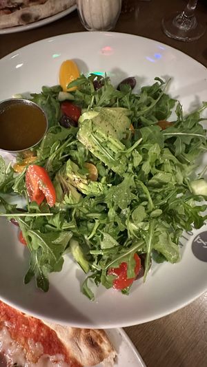 Salad with olive, tomatoes, arugula and avocado   at Piola in Miami Beach