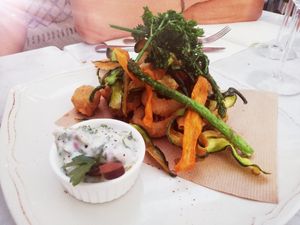 Delicious Calamari Fritti burried under assorted vegetables at Spritz in Antwerpen